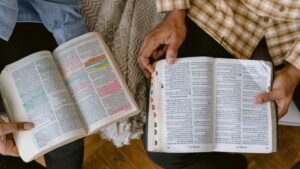 two people comparing bible notes