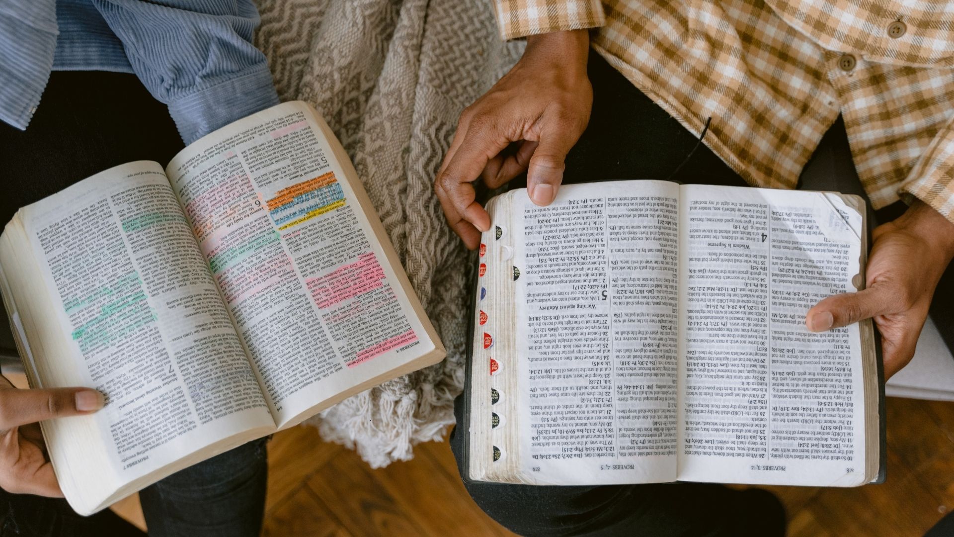 two people comparing bible notes