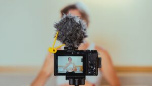 woman in camera doing social media evangelism